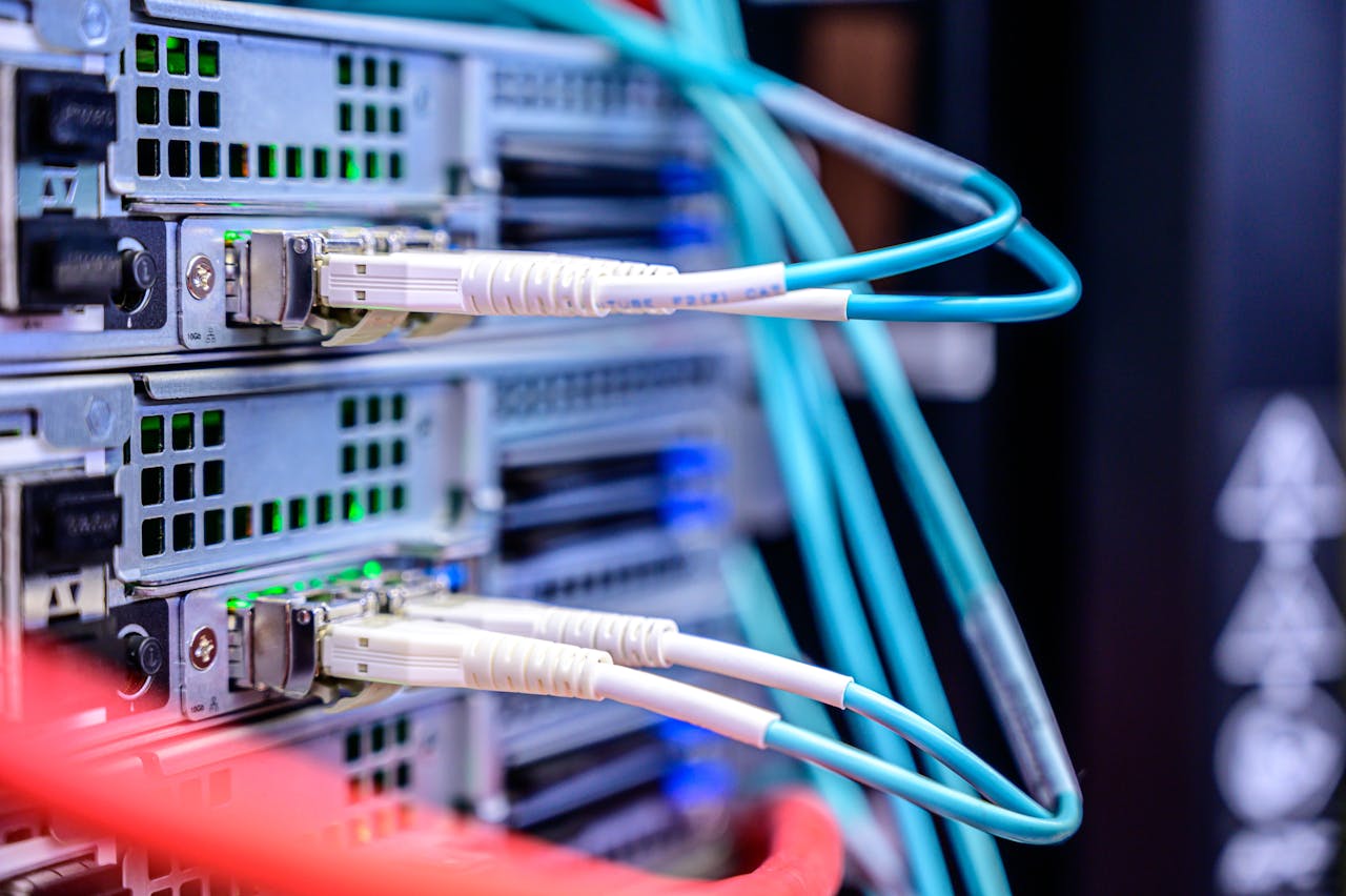 creative Detailed shot of Ethernet cables connected to server ports highlighting technology infrastructure.